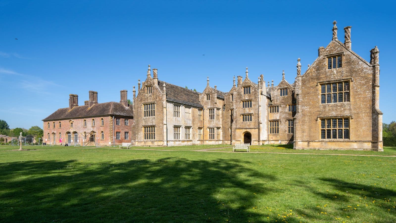 Country estate with manicured lawns in bright daylight