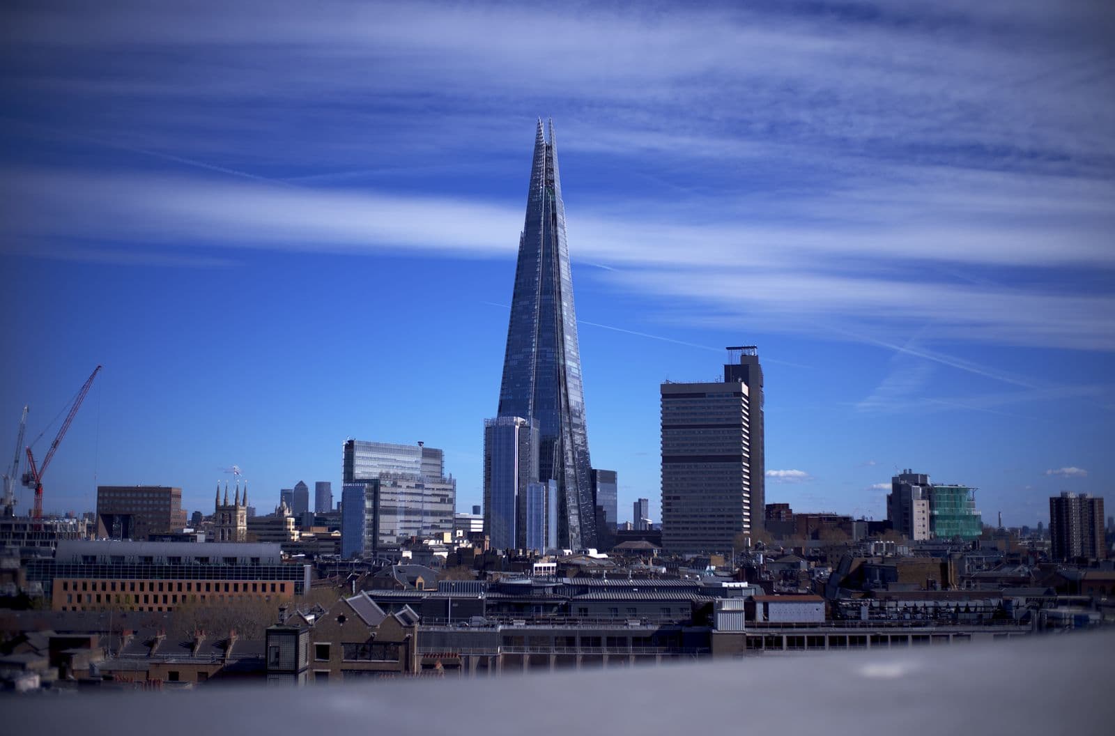 The Shard and the London skyline under a clear blue sky